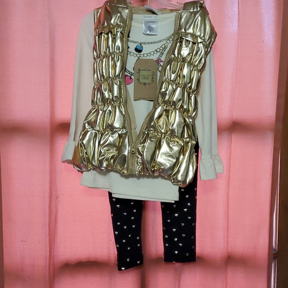 Black and gold outfit with gold vest